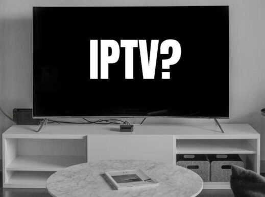 Black screen displaying 'IPTV?' on a modern television placed in a living room setting with a white entertainment unit